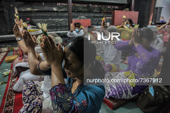 Hindu-Balinese people offering prayers during the Galungan Hindu festival at Pura Agung Raksa Buana on November 10, 2021 in Medan, Indonesia...