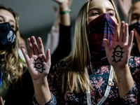 Young activists protest in the COP26 venue - Scottish Event Campus during the eleventh day of the COP26 UN Climate Change Conference, held b...