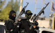 Fighters with the Saraya al-Quds Brigades, the armed wing of the Palestinian Islamic Jihad...