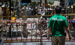 A worker watch inside the Erawan area, as 2 investigators works, in Bangkok, Thailand, on...