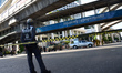 Thai policeman stands guard at the scene of the bomb balst at the Erawan Shrine in Bangkok...