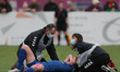  Durham Women's Kathryn Hill receives treatment from club doctor Dougal Southward and phys...