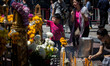 A kid laid flowers inside the reopened Erawan Shrine in Central Bangkok on August 19th 201...