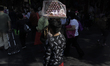 A meringue vendor near the Zócalo in Mexico City during the COVID-19 health emergency and...