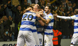 QPR's Charlie Austin is swamped by team mates after his goal during the Sky Bet Championsh...
