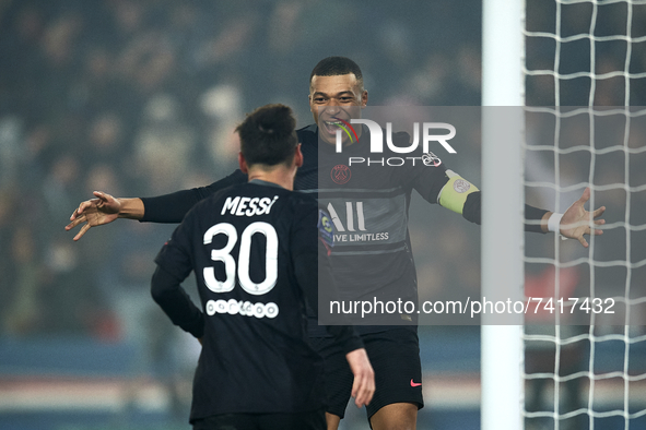 Leo Messi of PSG celebrates with Kylian Mbappe after scoring his sides first goal during the Ligue 1 Uber Eats match between Paris Saint Ger...