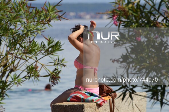 Croatian weather: Tourists and local enjoying in the summer sunshine on  21st Aug, 2015.Preko,Ugljan island,adriatic sea, Croatia 
