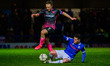 Liam Kelly of Rochdale AFC tackles Matt Jay during the Sky Bet League 2 match between Roc...