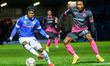 Abraham Odoh of Rochdale AFC under pressure from Jevani Brown of Exeter City FC during th...