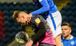 Jake Beesley of Rochdale AFC beats George Ray of Exeter City FC to the ball during the Sk...