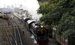 A steam locomotive leaves Bangkok Railway Station for a trip to mark the birthday of Thail...