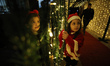 Palestinian Christians attend a Christmas tree lighting celebration in Gaza City, on Decem...