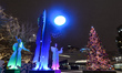 An Instalation in celebration of Winter Solstice by Jason Carter next to a giant Christmas...