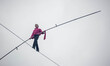 French tightrope walker Denis Josselin crossed the Seine on a steel wire 16 mm, in Paris,...