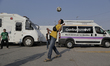Central American migrants play football in the facilities of the Casa Peregrino located in...