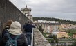 People walk along the main structure of the Aguas Livres aqueduct, Lisbon. 05 December 202...