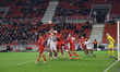 Action moment with players in the air during OIympiako's attack. Europa League game betwee...