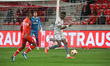 Pape Abou Cissé #66 of Olympiakos with the ball and Mbwana Ally Samatta #70 of Antwerp dur...