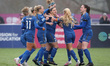 Durham Women's Abby Holmes celebrates with her team mates after scoring their and her seco...