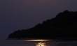 Super moon is seen over the Black sea town of Varna, 29, August, 2015. A supermoon is the...