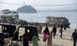 People arrives in the banks of Brahmaputra river to catch a ferry to visit Umananda Temple...