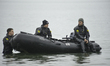 Rescuers monitor people participating in the annual Polar Bear Plunge on Coney Island in t...