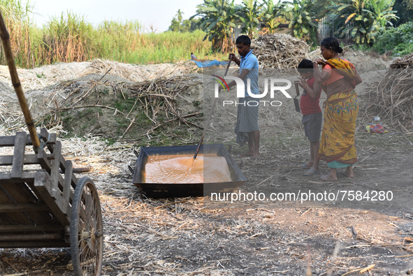 Workers making Gur (jaggery) in a village on December 10, 2021 in Barpeta, Assam, India. Gur (jaggery) is a natural product of sugarcane, ma...