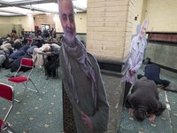 Unidentified men pray next to effigies of the Iranian top military commander General Qasem Soleimani who was killed in a U.S. drone attack i...