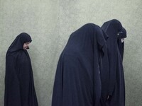 Unidentified veiled women pray during a death anniversary of the Iranian top military commander, General Qasem Soleimani, who was killed in...