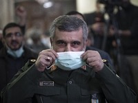 Iranian Commander of Aerospace Force of the Islamic Revolutionary Guard Corps (IRGC), Amir Ali Hajizadeh, wears a protective face mask while...