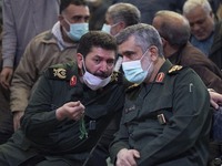 Iranian Commander of Great Tehran's Mohammad Rasoolullah Corps, Hassan Hassanzadeh (L) gestures as he speaks with the Iranian Commander of A...