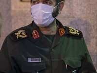 Iranian Commander of Great Tehran's Mohammad Rasoolullah Corps, Hassan Hassanzadeh wearing a protective face mask as he attends a death anni...