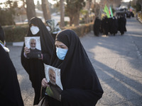 Iranian veiled women carrying portraits of the Iranian top IRGC commander, General Qasem Soleimani who was killed in a U.S. drone attack in...