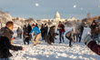 People engage in a huge snowball fight on the National Mall after an unexpected snowstorm...