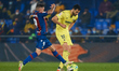 Vicente Iborra (R) of Villarreal CF competes for the ball with Roger Marti Salvador of Lev...