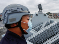 A navy soldier is seen standing guard next to Hsiung Feng missile launchers on a Taiwanese military corvette during a Navy Drill for Prepare...