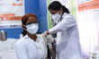 A nurse administers a booster dose of COVID-19 vaccine to a health worker n in Guwahati, A...