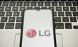 In this photo illustration a LG Corp. logo seen displayed on a smartphone screen with a co...