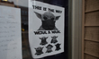 A poster 'This Is The Way. Wear A Mask' seen at the entrance to the store in Edmonton.Alb...