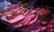 A fishmonger stall in a wet market at Kai Yip estate displays a fish cut open with its swi...