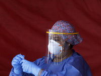 A health worker checks results of persons that  underwent an antigen test at Plaza Forum after  increase cases of Covid-19 Omicron variant i...
