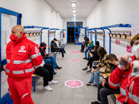 Teens in the waiting room after having the vaccine during the night dedicated to 12-19 year olds at the Cozzoli vaccination hub in Molfetta...