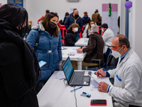 Doctors at work during the night dedicated to 12-19 year olds at the Cozzoli vaccination hub in Molfetta on 15 January 2022.
The initiative...