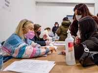 Volunteers at work during the night dedicated to 12-19 year olds at the Cozzoli vaccination hub in Molfetta on 15 January 2022.
The initiat...