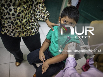 A child looks receive the second dose of the xinovac covid-19 vaccine in South Tangerang, Banten, Indonesia on 17 January 2022. Indonesia is...