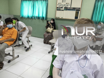 Students waiting in line for the Covid-19 vaccine in South Tangerang, Banten, Indonesia on 17 January 2022. Indonesia is preparing to face t...