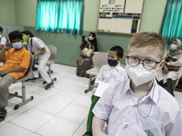Students waiting in line for the Covid-19 vaccine in South Tangerang, Banten, Indonesia on 17 January 2022. Indonesia is preparing to face t...