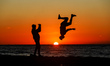 A Palestinian youth practice his parkour skills in the beach of Gaza City during Sunset, o...