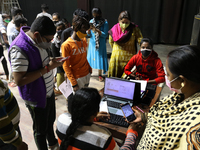 People register themselves to get inoculated against coronavirus inside a Vaccine Center  in Kolkata , India on January 19, 2022. (