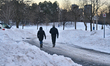 People walk along a road in Toronto, Ontario, Canada, on January 18, 2022, following yeste...